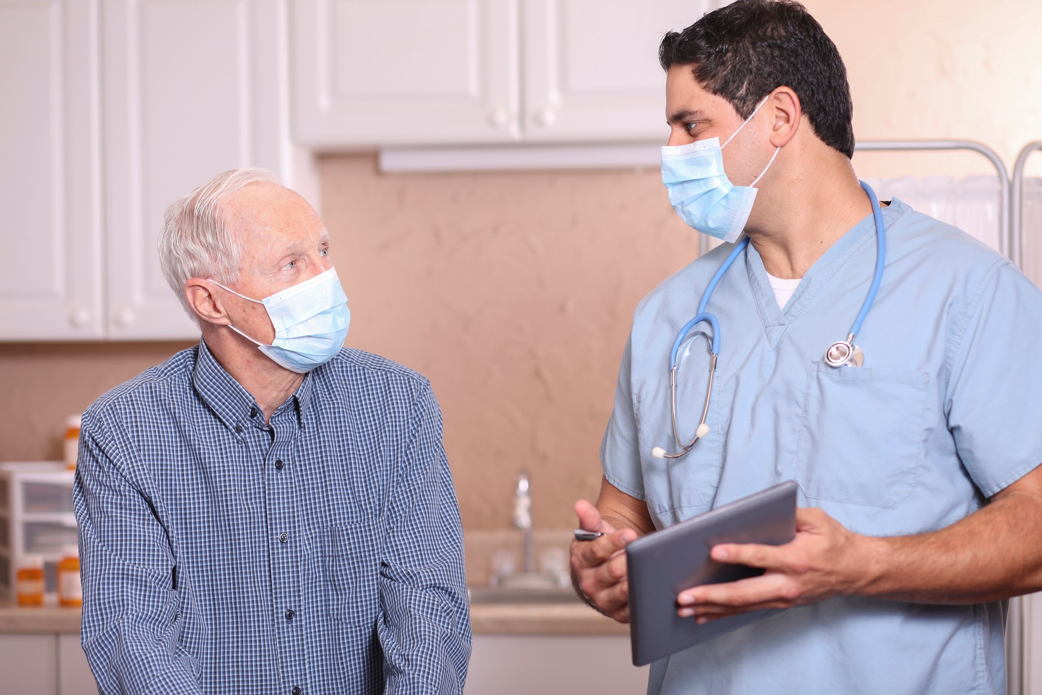 A doctor and patient speak during an appointment.