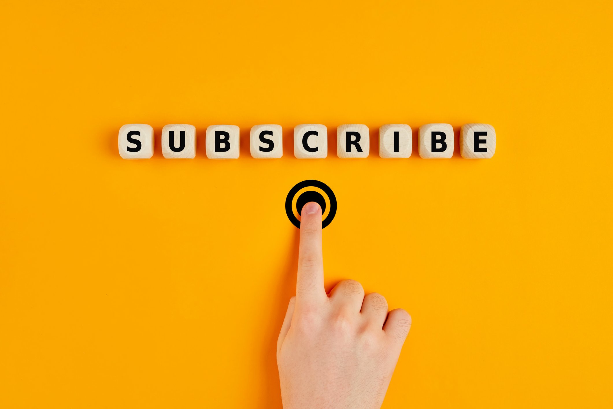 Person pressing a subscribe button. 