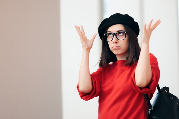 A person rolls their eyes and shrugs.