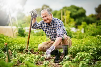 A smiling person gardening_GettyImages-808193804