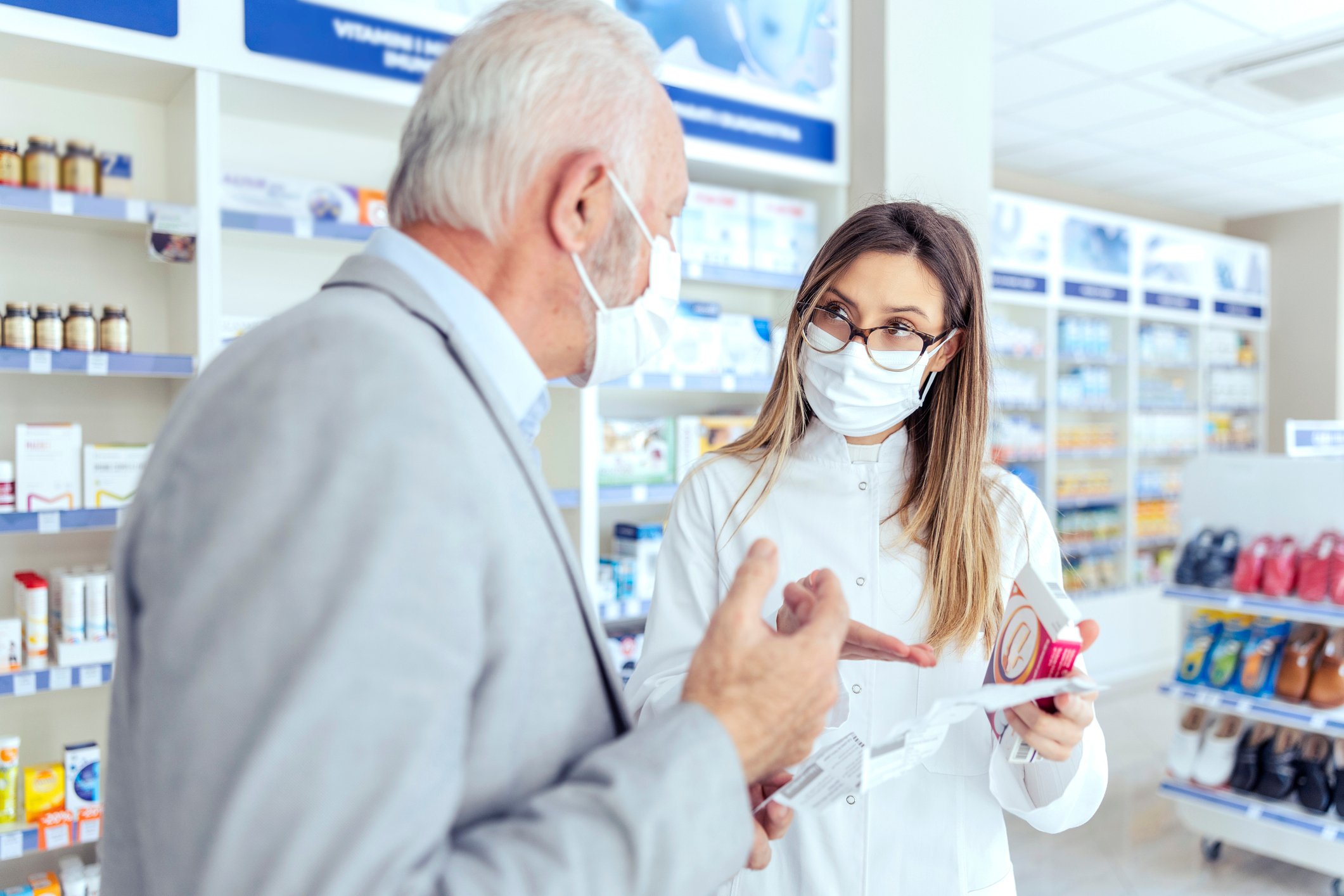 Two people working in a pharmacy.