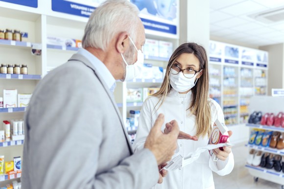 Two people working in a pharmacy.