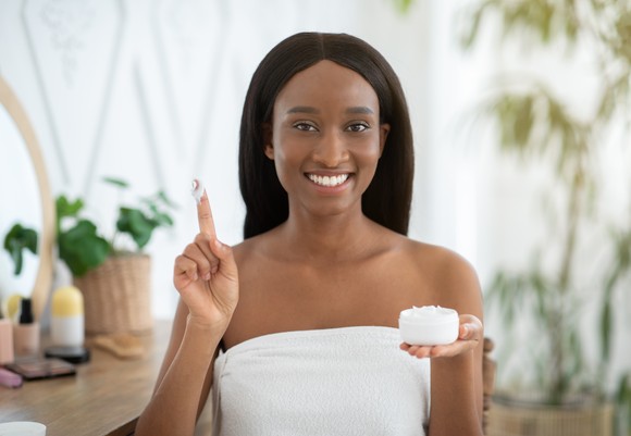 Woman holds up spa treatment