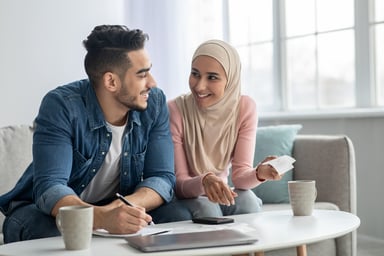 A couple calculating their finances.