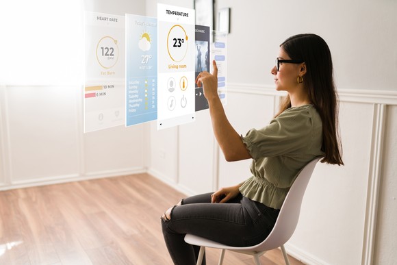 Someone wearing smart glasses to interact with apps.