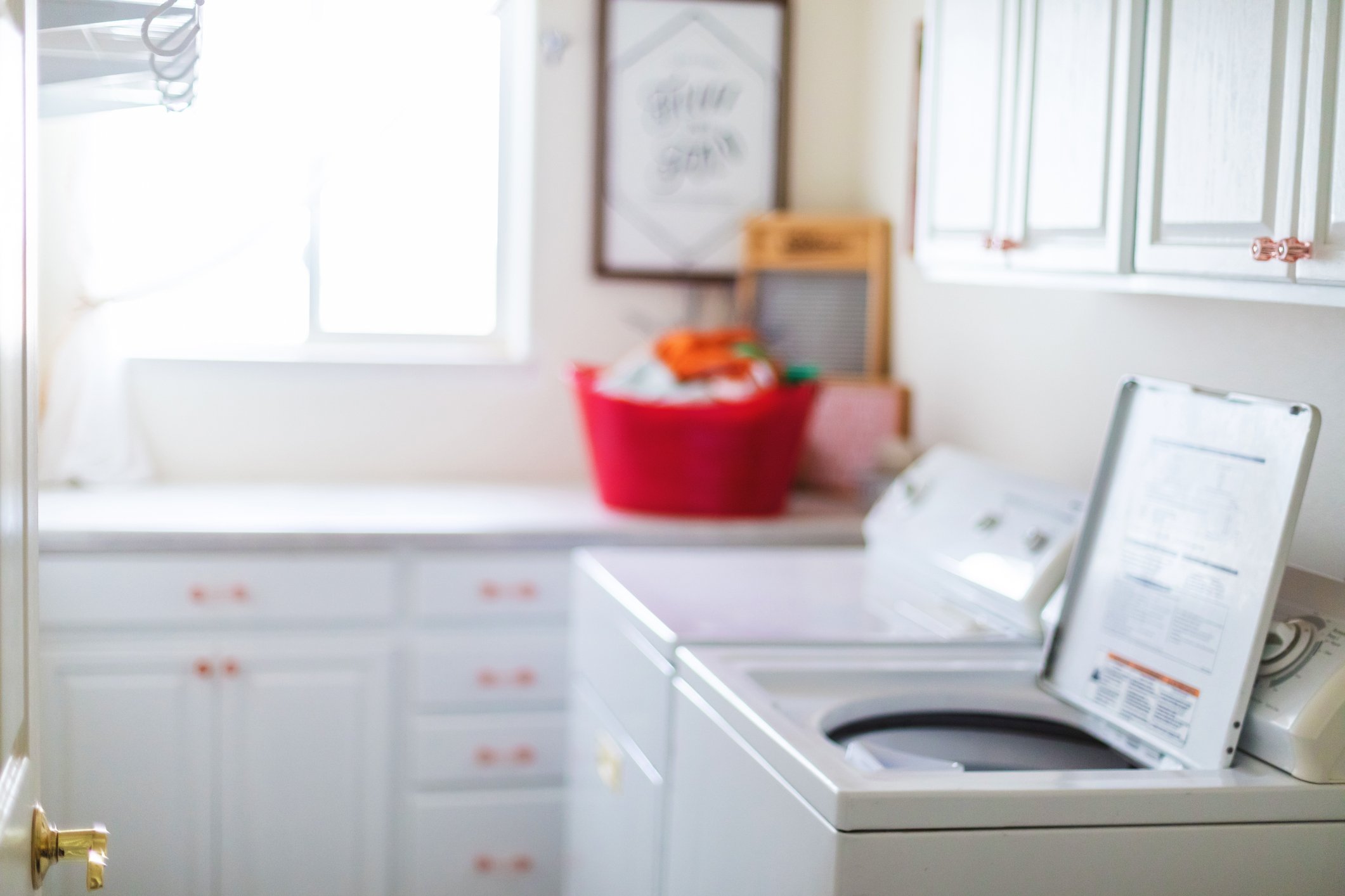 Washing machine and dryer in a laundry room.