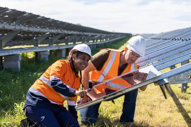 Engineers Working On Solar Farm Installation.