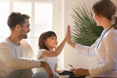 patient giving a doctor a high-five