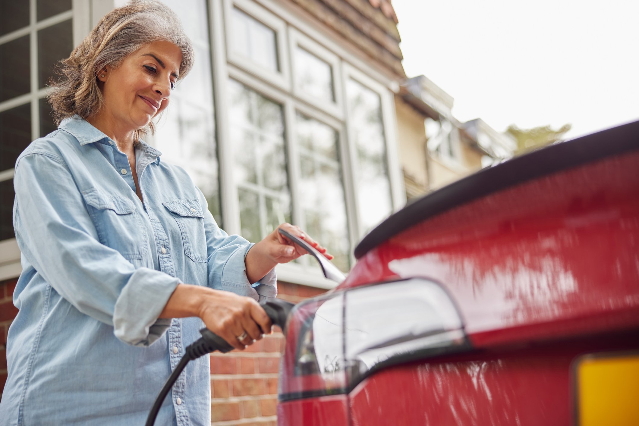 woman-charging-car