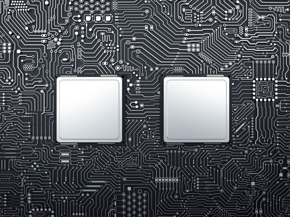 Two semiconductors on a motherboard.