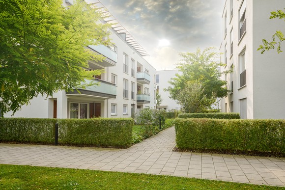 A courtyard of an apartment complex. 