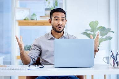 Young man pleasantly surprised, laptop