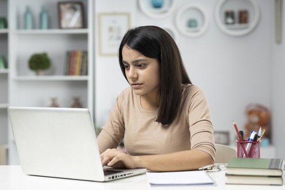 A person doing work on a laptop.