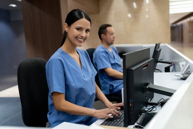 healthcare info desk attendants at computers