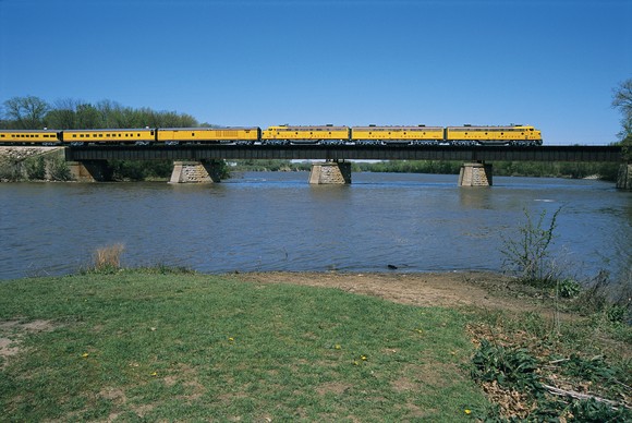 A Union Pacific train goes across a bridge.