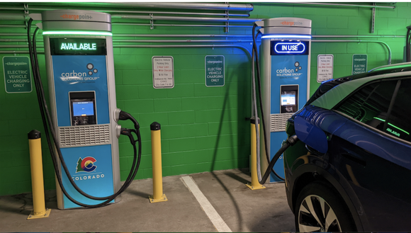 ChargePoint chargers with one in use in a parking garage.