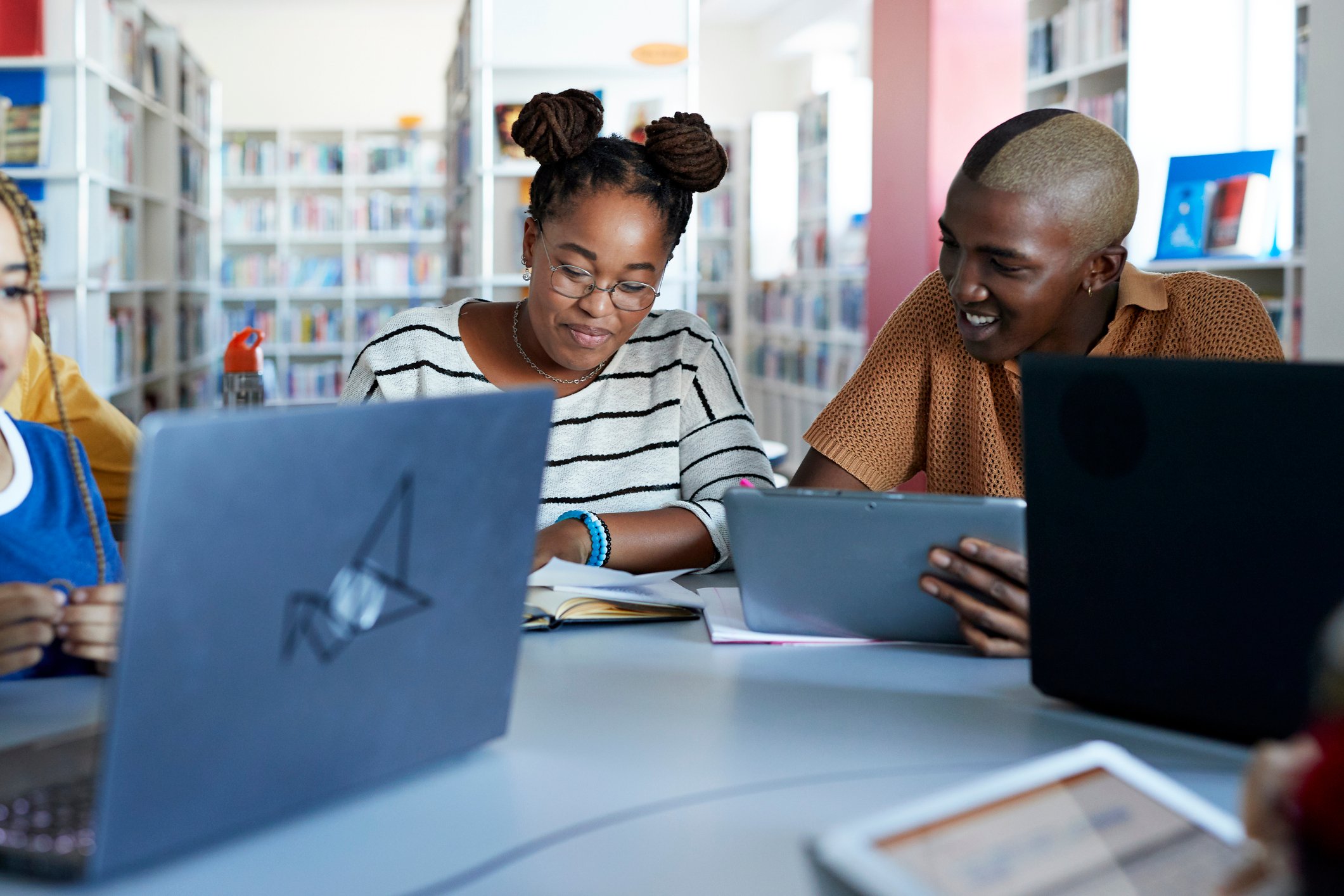 A group of people in a library.