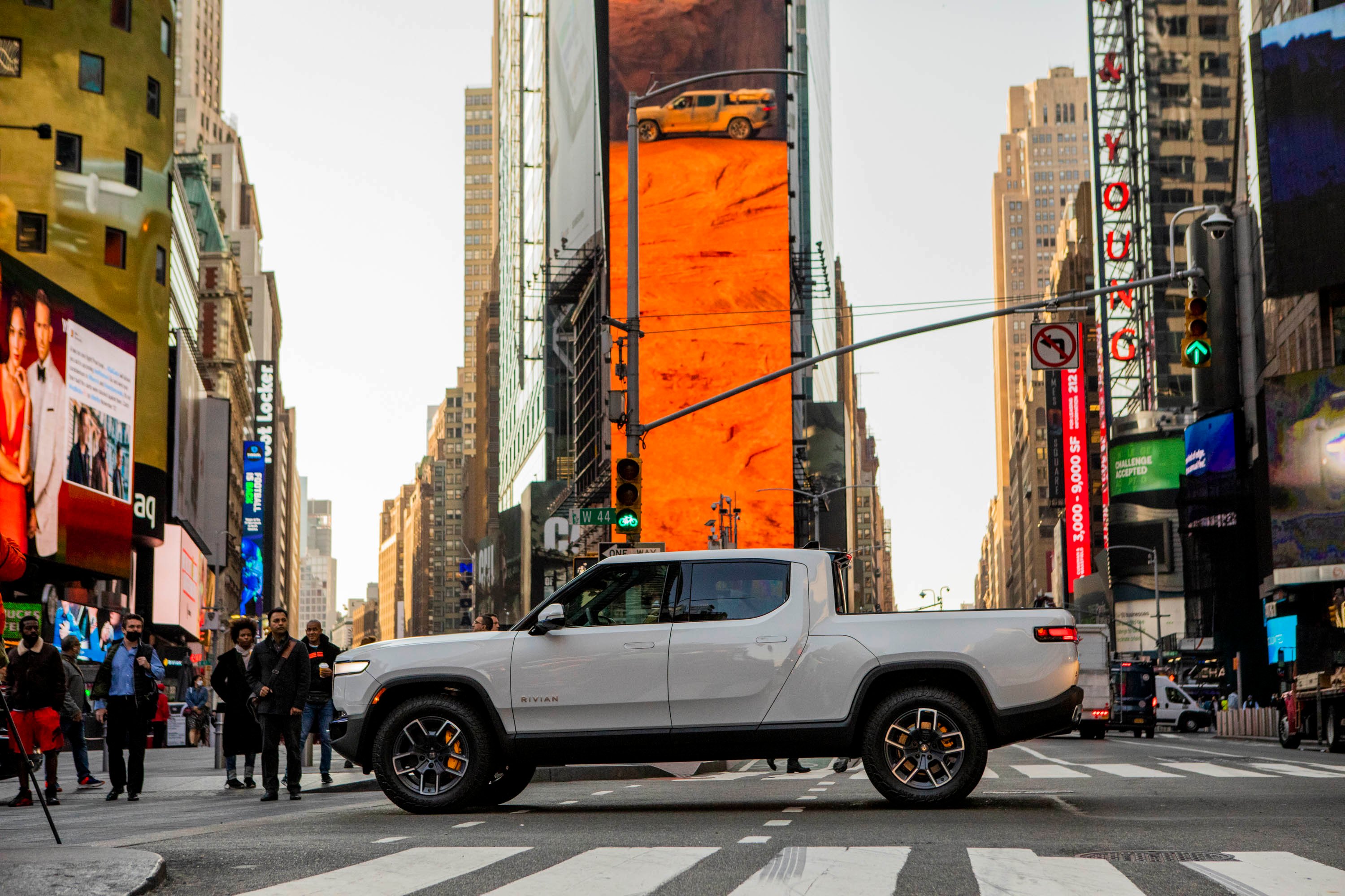 white Rivian R1T pickup in Times Square on day of Rivian public listing. 