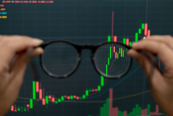 Stock chart being viewed through eye glasses, making the image more clear.