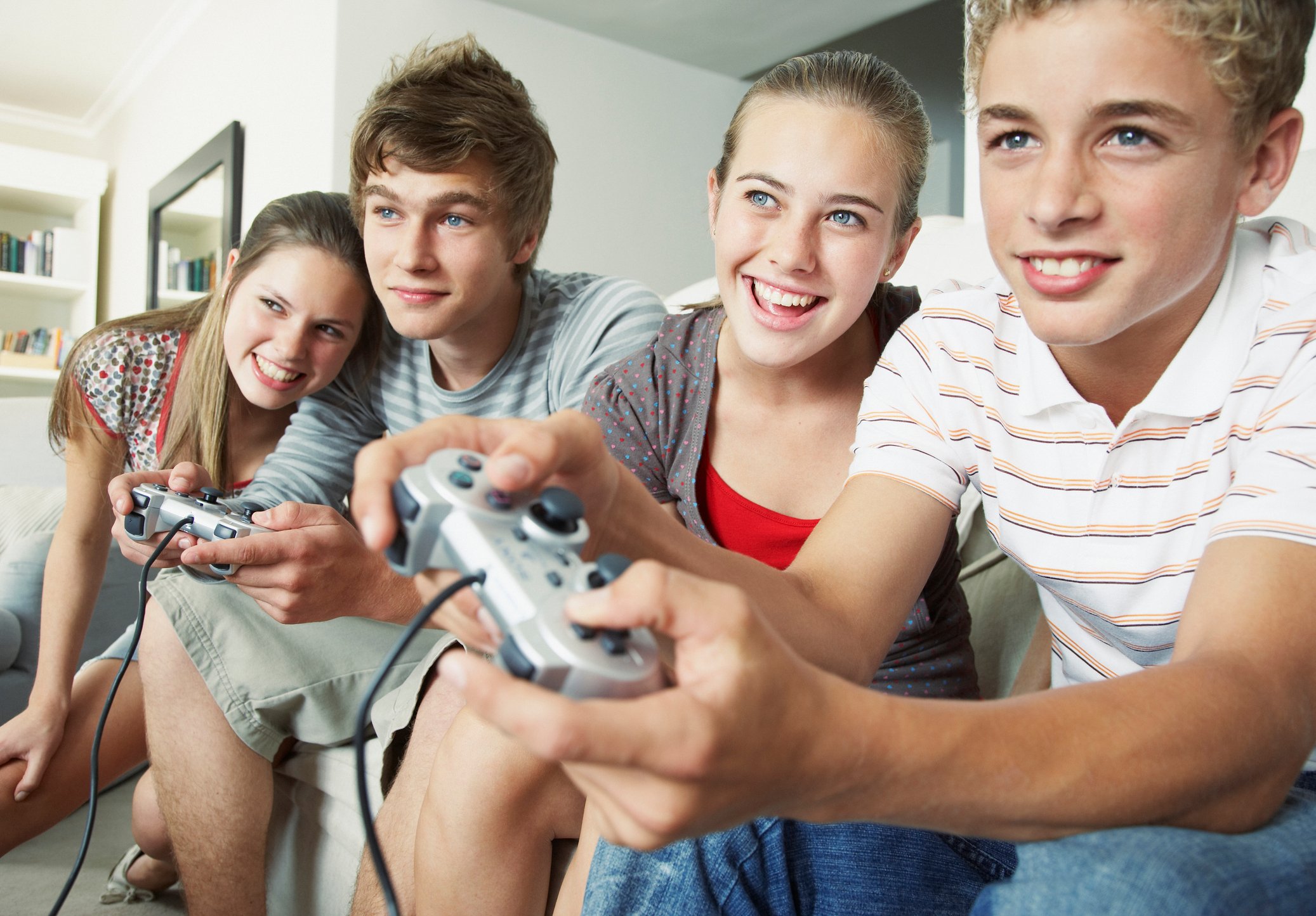 Four friends gaming together.