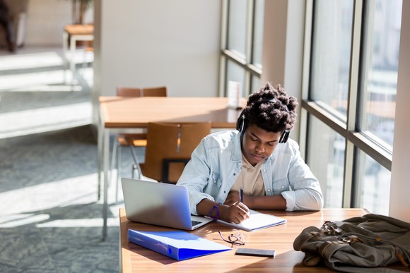 A person doing work at a desk.
