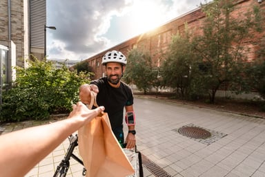 Person on a bike delivering food.