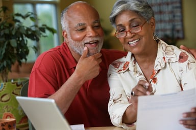 A couple reviewing a statement.