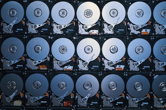Hard disks lined up on a wall. 