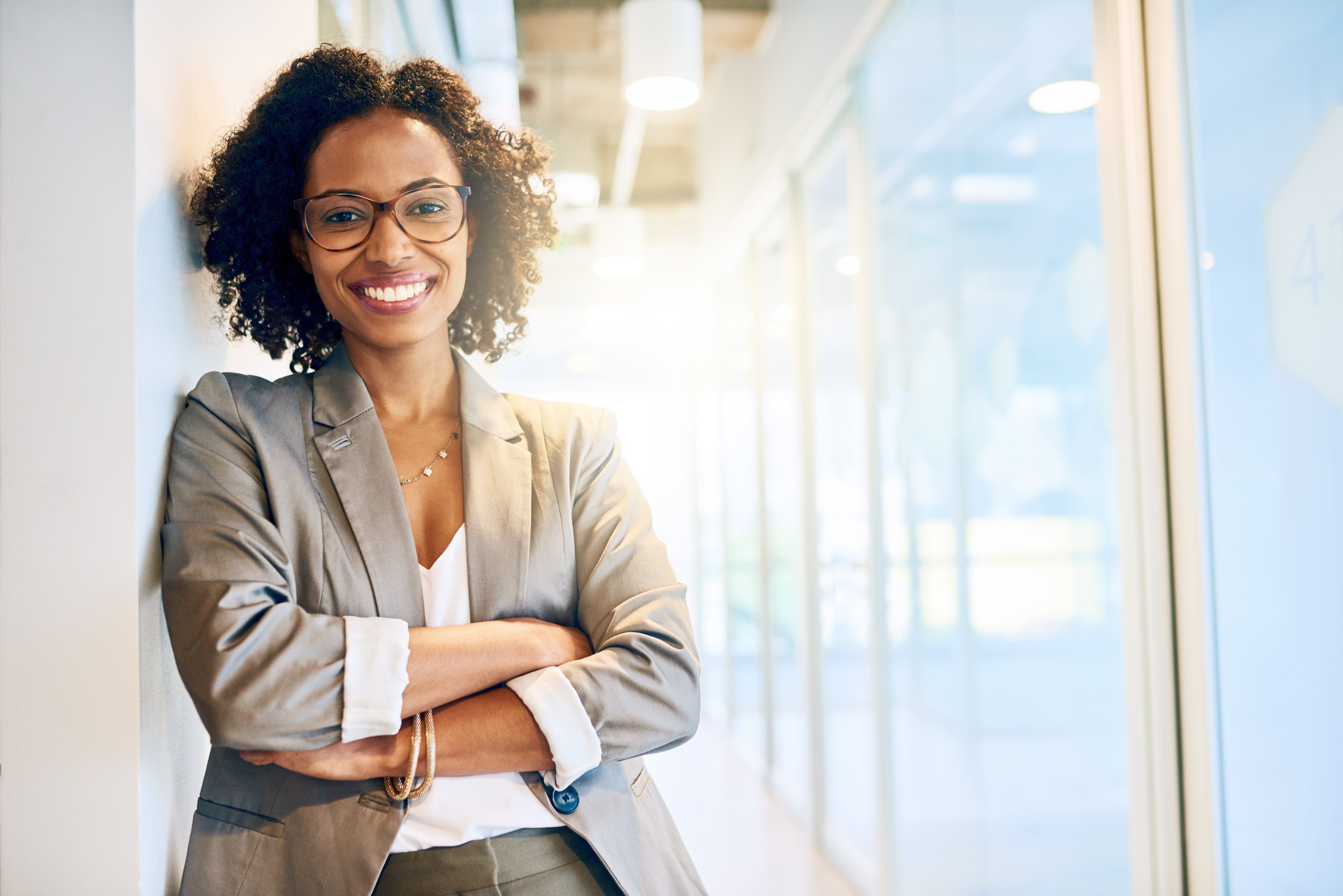 A businessperson standing in office.
