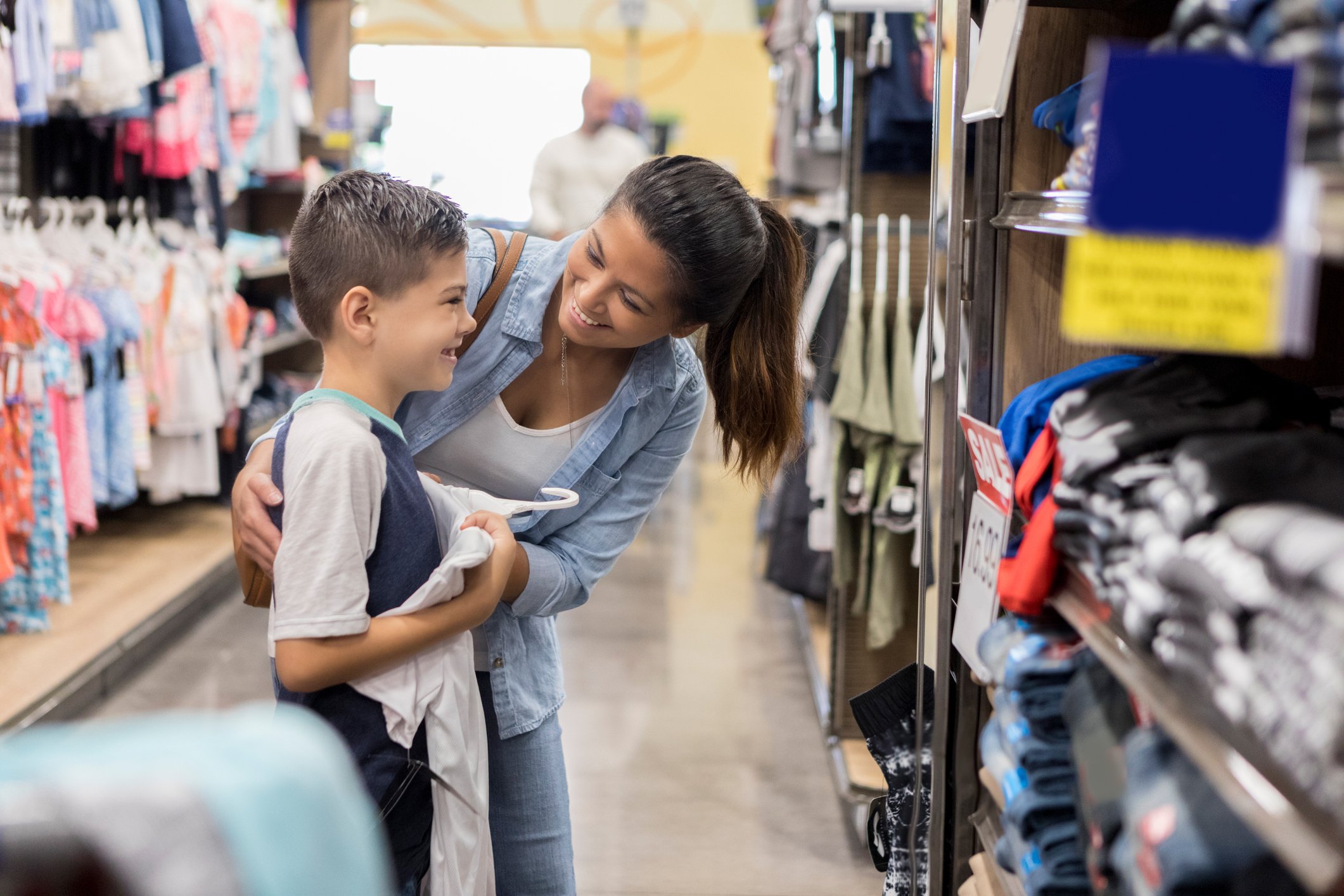 Two people shopping in a department store.