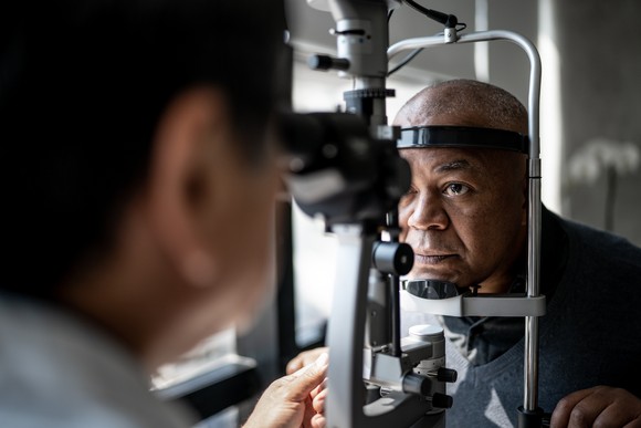 Person in the midst of receiving an eye exam.