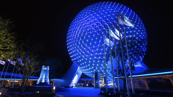 Epcot's Spaceship Earth illuminated at night.