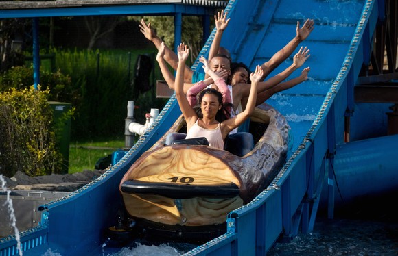 A family on a waterpark slide.