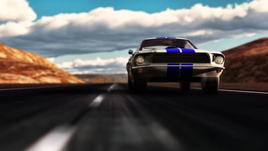 Classic Ford Mustang races down an open road.
