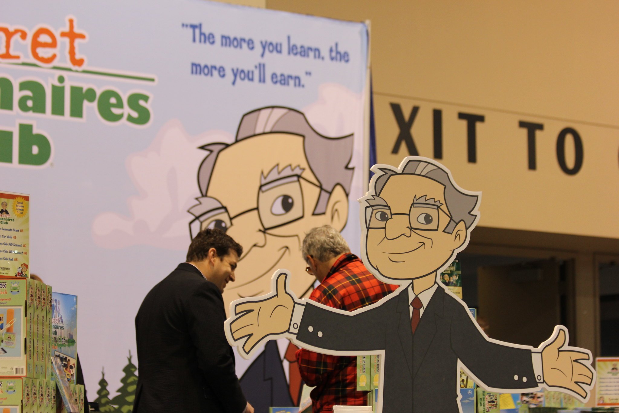 A cartoon version of Warren Buffett at a conference.