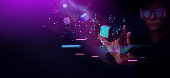 A person manipulates blocks in virtual reality.