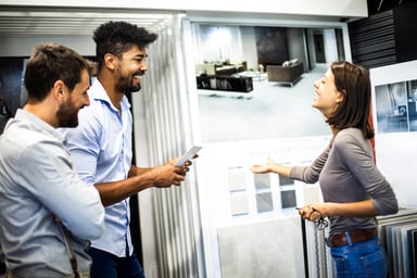People looking at samples in a furniture store