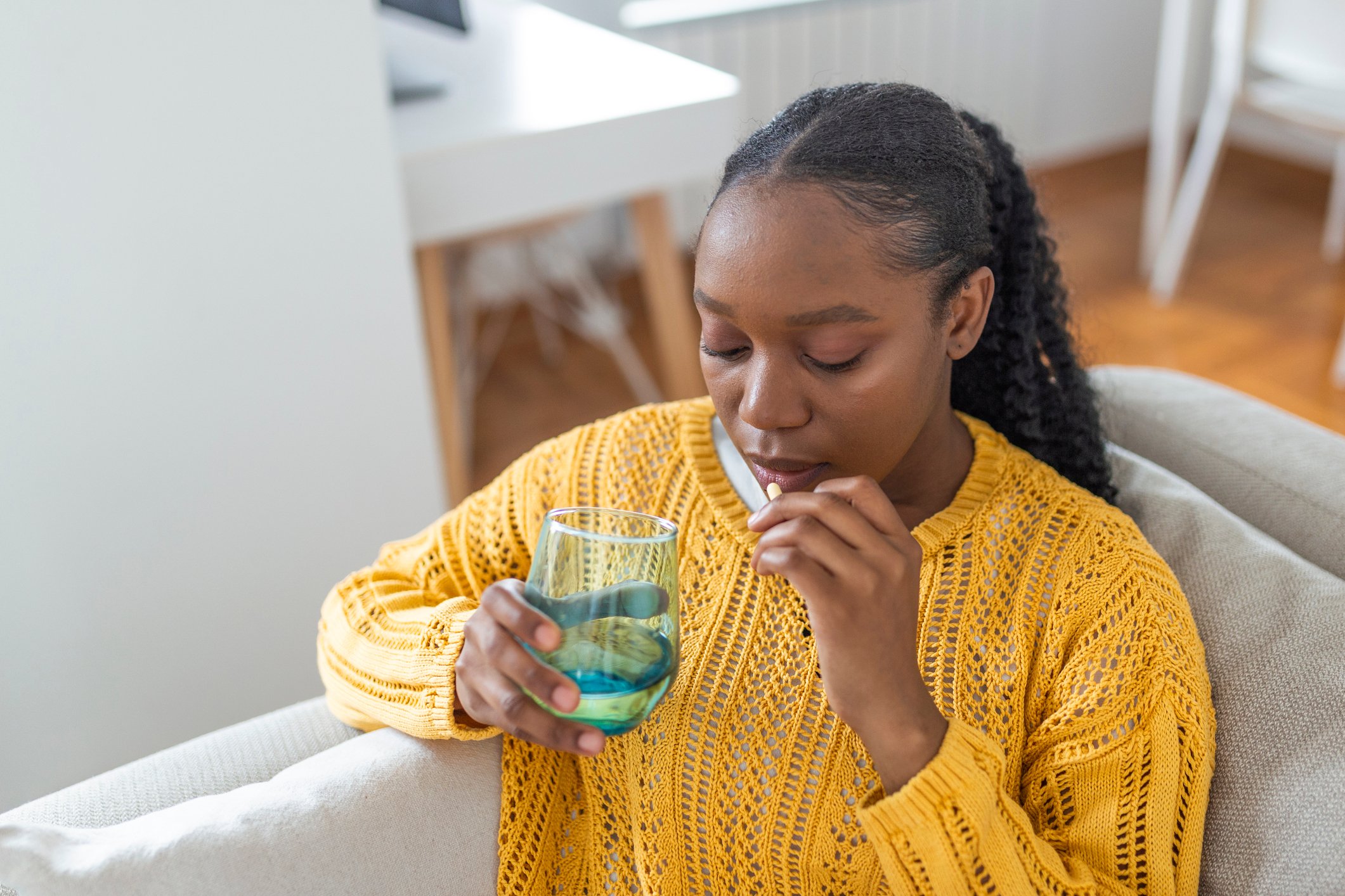 Patient drinking medicine.