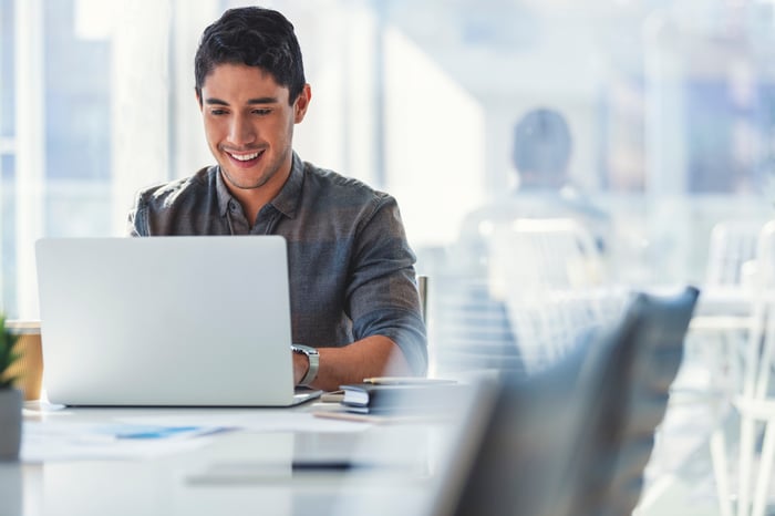 A person at a laptop.