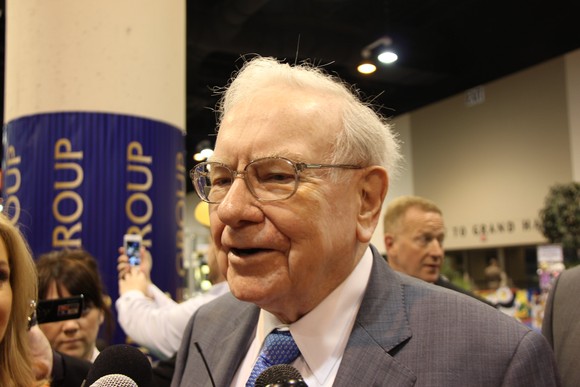 Warren Buffett speaking at an event.