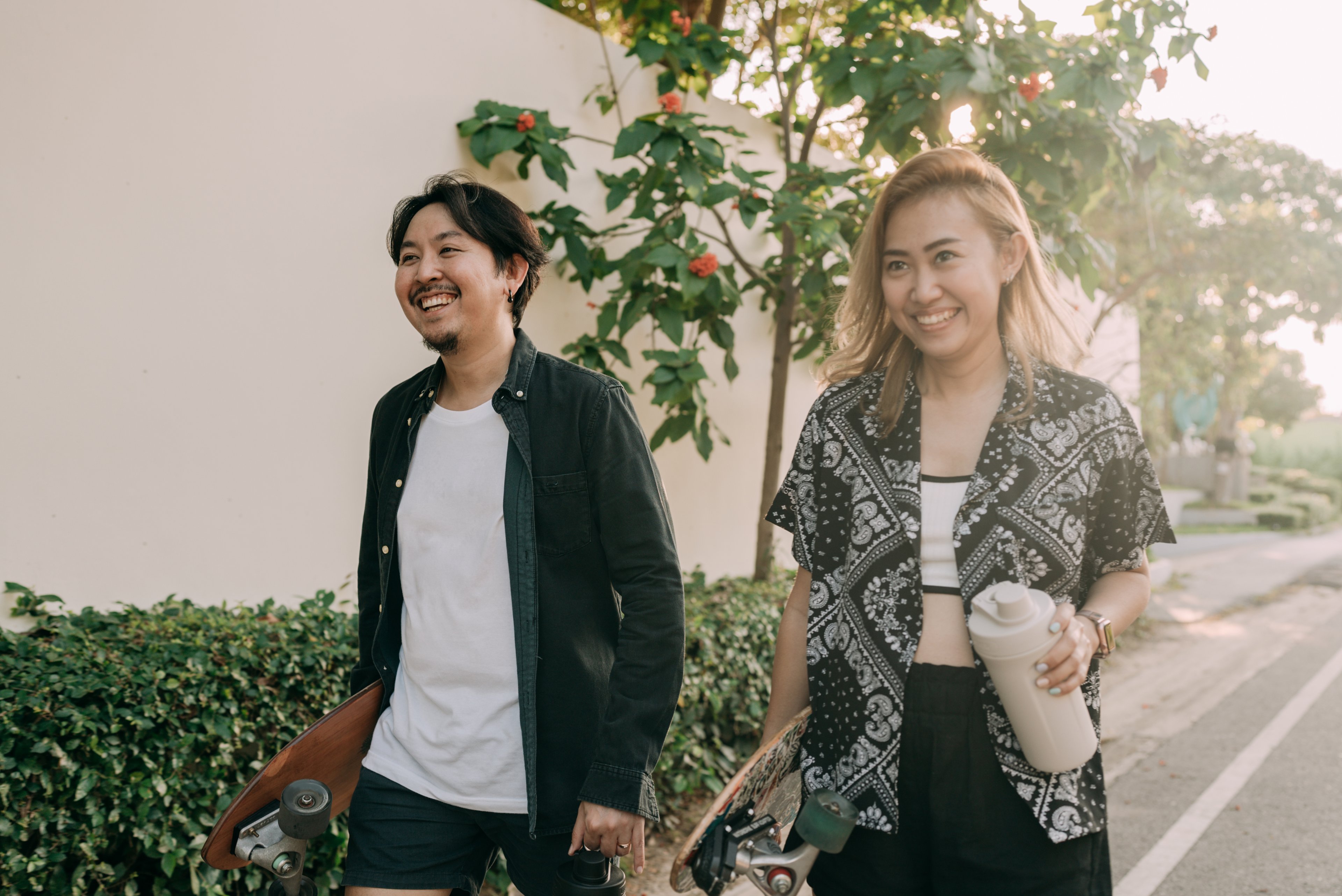 Young adults wearing fashionable surf/skate style clothing