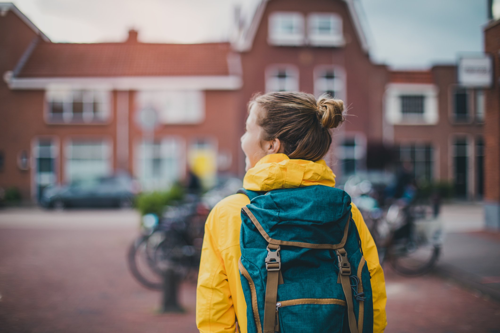 A student walking toward student housing.