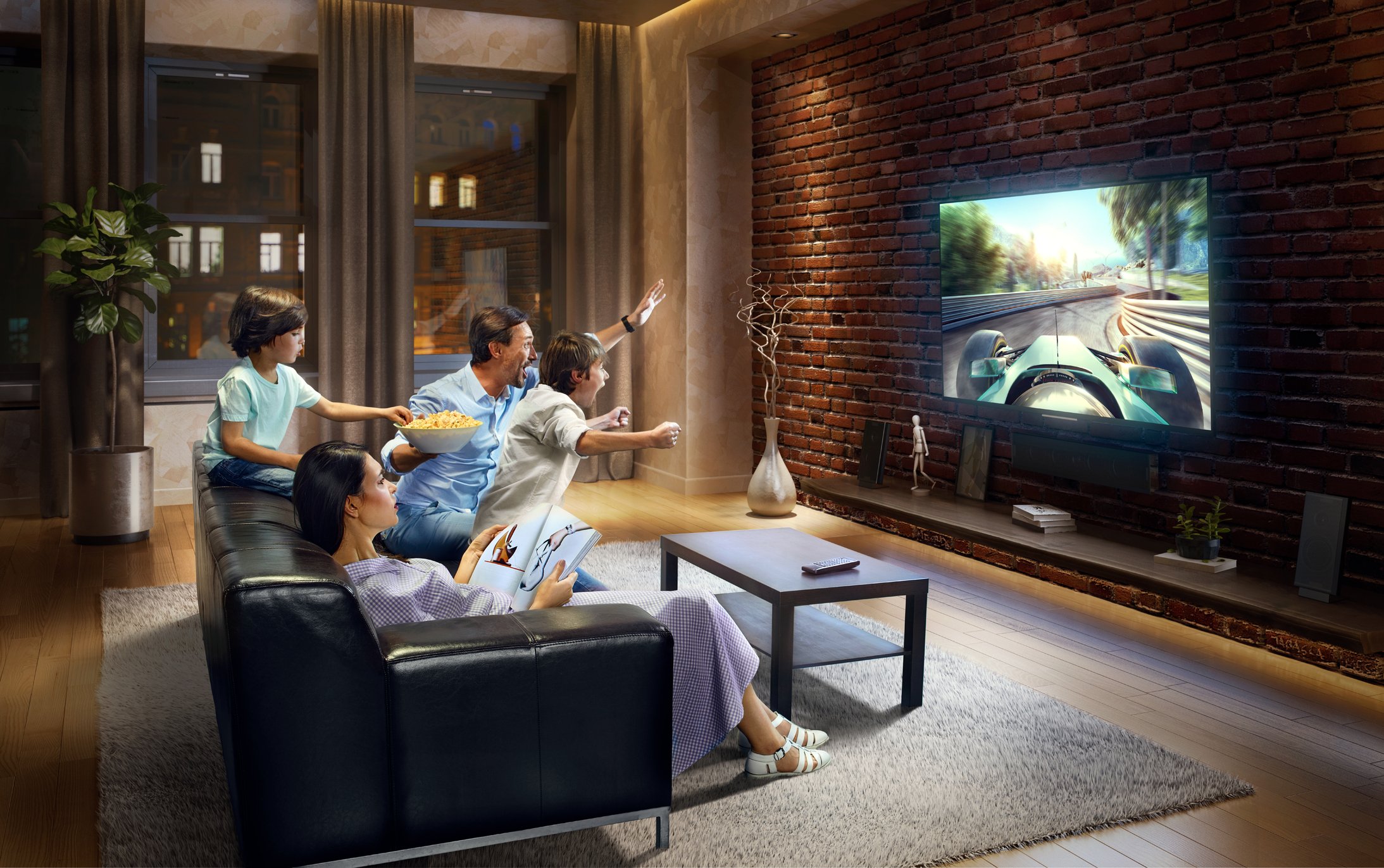 A family gathers in the living room to watch tv.