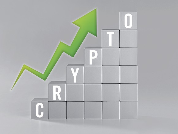 Blocks stacked up in upward formation with the word "crypto" overlayed on top.
