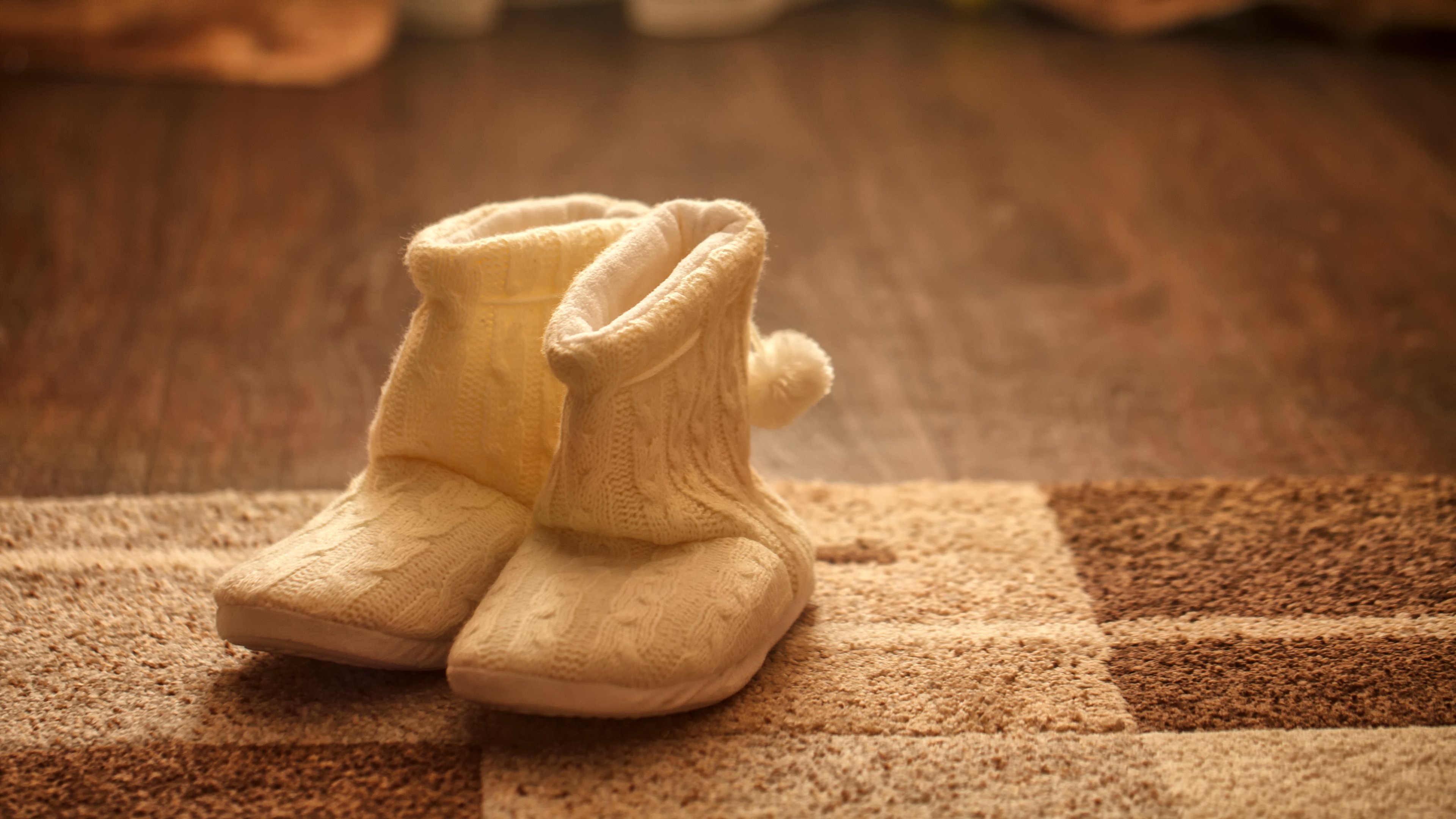 Fuzzy UGG boots on a carpet 