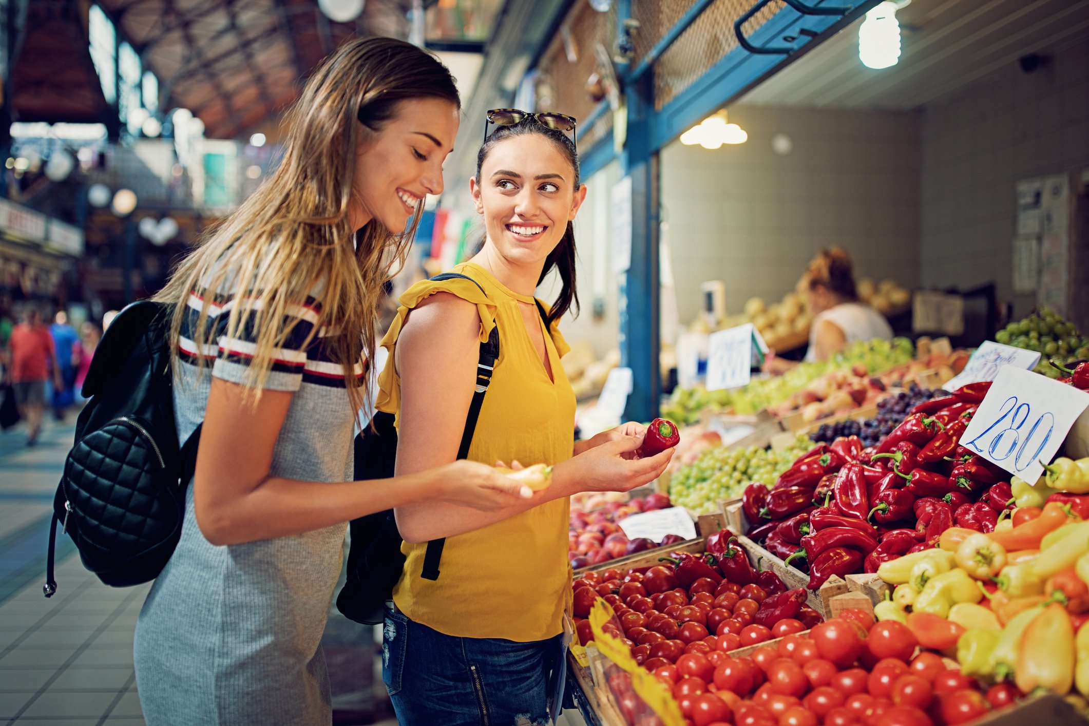 Fruit and vegetable shoppers in a market. 