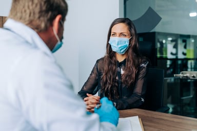 A person meets their doctor for an appointment