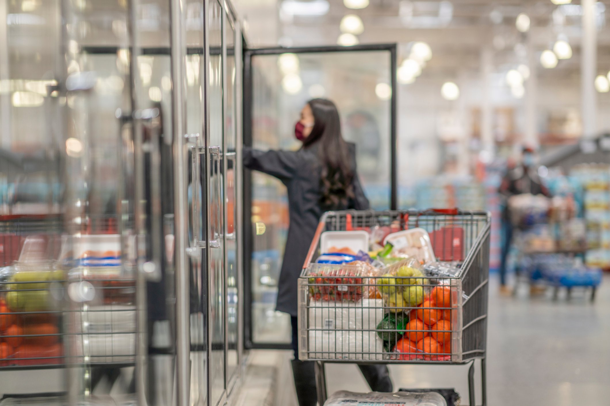A person shopping in a warehouse.
