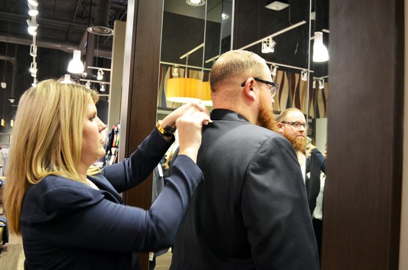 Person being fitted for a suit.