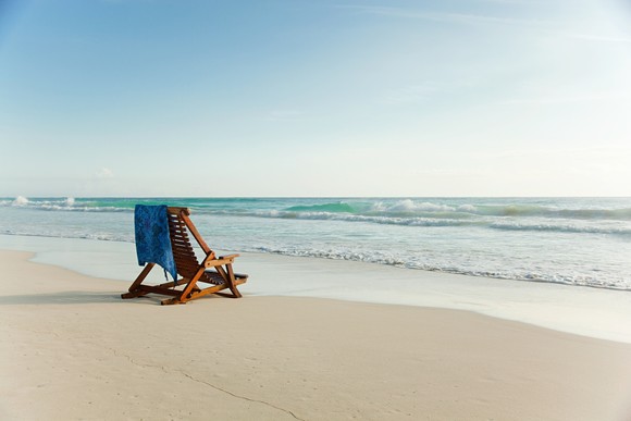 A chair set up on the beach.